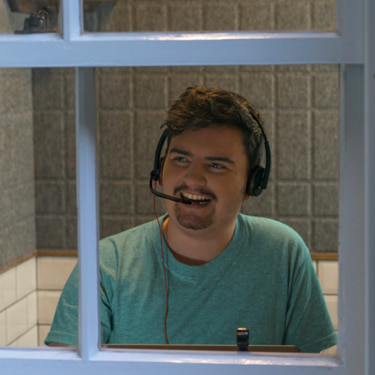 Receptionist answering call over headphone